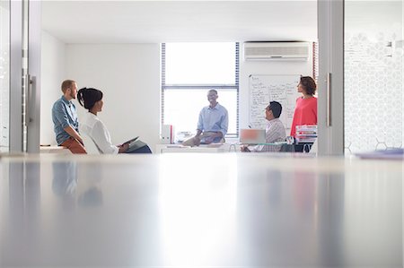 five people talking - Group of business people working in white modern office Stock Photo - Premium Royalty-Free, Code: 6113-07808807