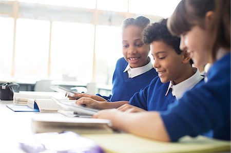 preteen girl hold book - Schoolboys and schoolgirls learning in classroom Stock Photo - Premium Royalty-Free, Code: 6113-07961413