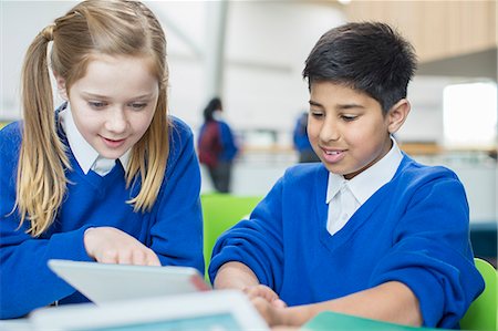 electronic school desk - Boy and girl wearing school uniforms using digital tablet together Stock Photo - Premium Royalty-Free, Code: 6113-07961431