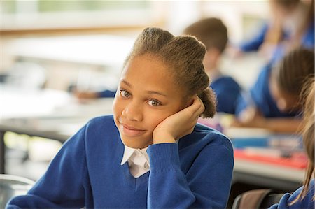 simsearch:6113-07961473,k - Portrait of smiling elementary school girl sitting bored in classroom Stockbilder - Premium RF Lizenzfrei, Bildnummer: 6113-07961515