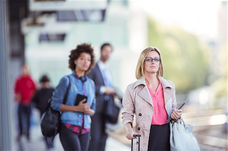 simsearch:6113-07961610,k - People waiting at train station Stock Photo - Premium Royalty-Free, Code: 6113-07961658