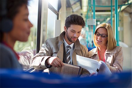 simsearch:6113-07961591,k - Business people talking on train Stock Photo - Premium Royalty-Free, Code: 6113-07961600