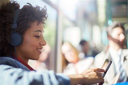 Woman using digital tablet on train Stock Photo - Premium Royalty-Free, Code: 6113-07961604