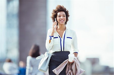 food outdoor - Businesswoman talking on cell phone in city Stock Photo - Premium Royalty-Free, Code: 6113-07961605