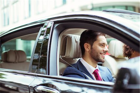 full suit - Businessman smiling in car Stock Photo - Premium Royalty-Free, Code: 6113-07961631