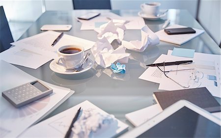 Messy table in conference room of modern office Stock Photo - Premium Royalty-Free, Code: 6113-07991932