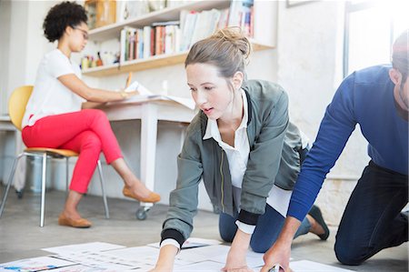 Three young people working together in studio Stock Photo - Premium Royalty-Free, Code: 6113-07992021