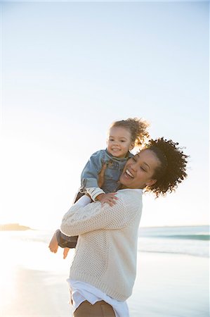 south africa photo people - Mother and daughter embracing on beach Stock Photo - Premium Royalty-Free, Code: 6113-07992117