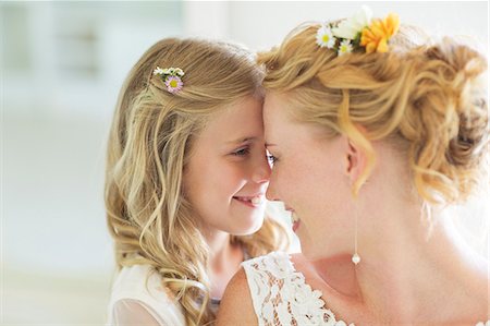 flower girls - Bride and bridesmaid facing each other smiling Stock Photo - Premium Royalty-Free, Code: 6113-07992131