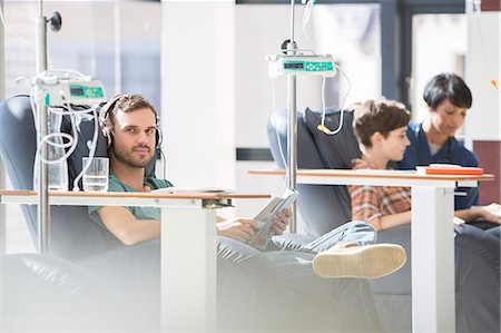 doctor and patient, portrait - Patients in armchairs receiving medical treatment in hospital ward Stock Photo - Premium Royalty-Free, Code: 6113-07905850