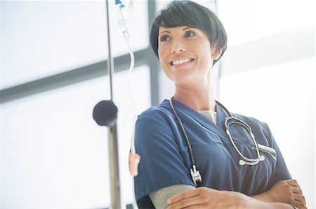 simsearch:6113-07905909,k - Portrait of female doctor in front of hospital window Stock Photo - Premium Royalty-Free, Code: 6113-07905871