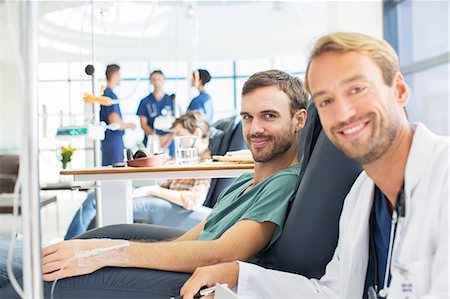 Portrait of smiling doctor and patient undergoing medical treatment in outpatient clinic Stock Photo - Premium Royalty-Free, Code: 6113-07905946