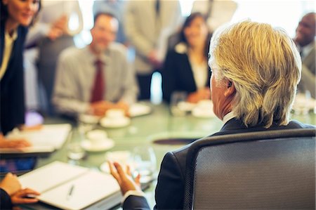 simsearch:6113-07906047,k - Rear view of mature businessman during business meeting Stock Photo - Premium Royalty-Free, Code: 6113-07906069