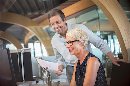 people office two man - Business people talking in office Stock Photo - Premium Royalty-Free, Code: 6113-07906261