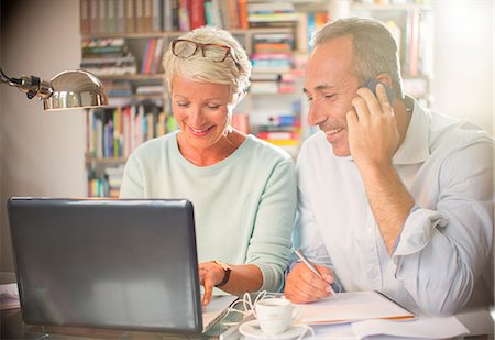 Business people working together at home office desk Stock Photo - Premium Royalty-Free, Code: 6113-07906202