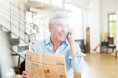simsearch:6113-07906343,k - Older man talking on cell phone with newspaper Stock Photo - Premium Royalty-Free, Code: 6113-07906206