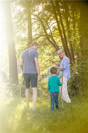 simsearch:6113-07906369,k - Boy, father and grandfather walking in forest Stockbilder - Premium RF Lizenzfrei, Bildnummer: 6113-07906391