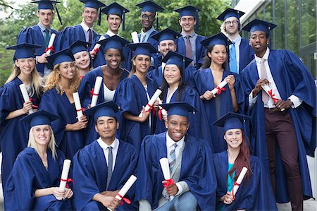 Portrait of university students in graduation gowns outdoors Photographie de stock - Premium Libres de Droits, Code: 6113-07906443