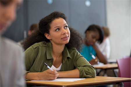 diversity - University student looking up during exam Photographie de stock - Premium Libres de Droits, Code: 6113-07906465