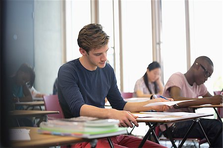 simsearch:6113-07808758,k - University student taking exam, students in background writing Stock Photo - Premium Royalty-Free, Code: 6113-07906481