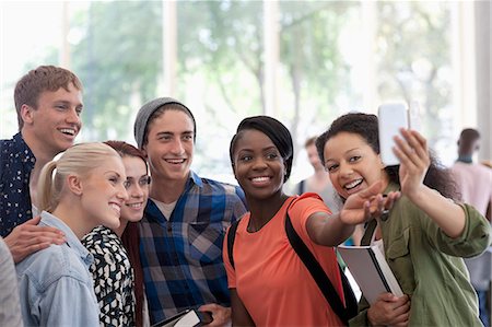 simsearch:6113-07906468,k - University students taking selfie in corridor during break Stock Photo - Premium Royalty-Free, Code: 6113-07906488