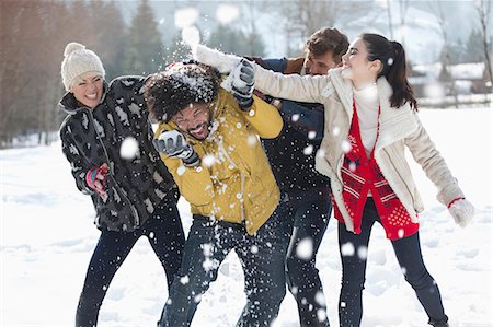 snowball fight photography - Friends enjoying snowball fight Stock Photo - Premium Royalty-Free, Code: 6113-07906594