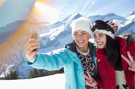 peace sign and woman - Friends taking selfie in snow Stock Photo - Premium Royalty-Free, Code: 6113-07906596