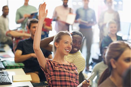 simsearch:6113-07906460,k - University student raising hand at IT seminar Foto de stock - Sin royalties Premium, Código: 6113-07906503