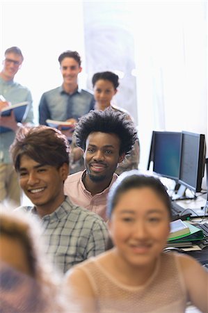 simsearch:6113-07906460,k - Group of students during lecture in sunlit classroom Photographie de stock - Premium Libres de Droits, Code: 6113-07906511