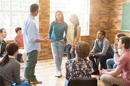 simsearch:6113-09058760,k - Man and women talking in group therapy session Stock Photo - Premium Royalty-Free, Code: 6113-08087987