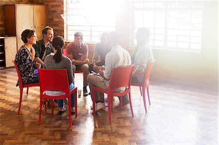 supportive - group therapy session in circle in sunny community center Stock Photo - Premium Royalty-Free, Code: 6113-08088025