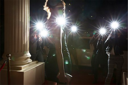 Silhouette of celebrity being photographed by paparazzi photographers at event Photographie de stock - Premium Libres de Droits, Code: 6113-08088219