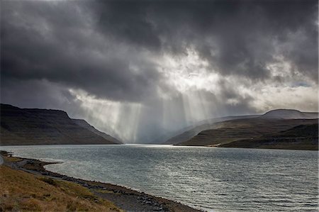 simsearch:6113-08088334,k - Sunbeams over cliffs and fjord, West Fjords, Iceland Stock Photo - Premium Royalty-Free, Code: 6113-08088353