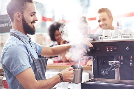 Barista steaming milk in cafe Stock Photo - Premium Royalty-Free, Code: 6113-08088470