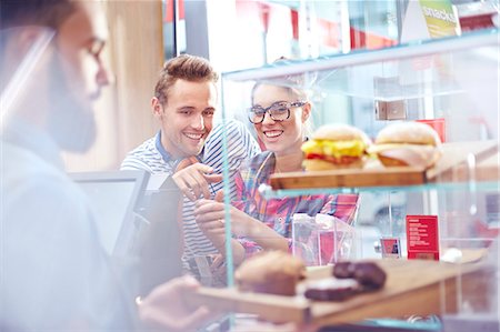 flare indoors - Couple choosing food at display case in cafe Stock Photo - Premium Royalty-Free, Code: 6113-08088474