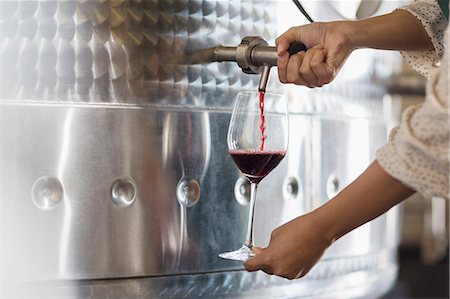 pouring drink - Vintner barrel tasting red wine from stainless steel vat Stock Photo - Premium Royalty-Free, Code: 6113-08171194