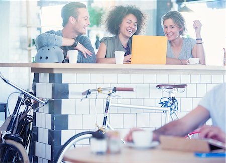 people coffee bar - Friends sharing laptop at cafe bar Stock Photo - Premium Royalty-Free, Code: 6113-08171377