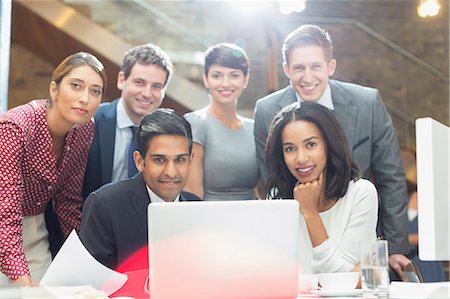 simsearch:6124-08768343,k - Portrait confident business people at laptop in office Stock Photo - Premium Royalty-Free, Code: 6113-08184268