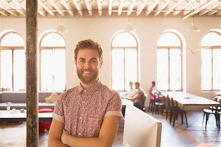 photography male poses - Portrait confident casual businessman in sunny office Stock Photo - Premium Royalty-Free, Code: 6113-08105389