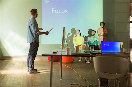 focus group - Business people preparing audio visual presentation on Focus Stock Photo - Premium Royalty-Free, Code: 6113-08105329