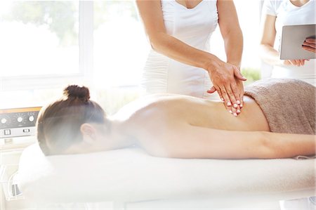 pain - Masseuse massaging woman's back Stock Photo - Premium Royalty-Free, Code: 6113-08105466