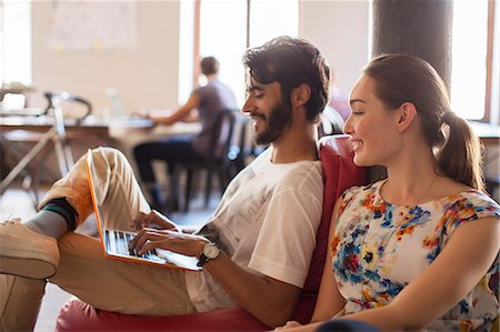 Casual business people using laptop in office Stock Photo - Premium Royalty-Free, Code: 6113-08105402