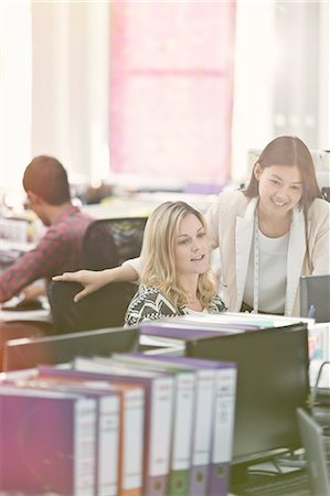 planning meeting - Fashion designers working at desk in office Stock Photo - Premium Royalty-Free, Code: 6113-08220336