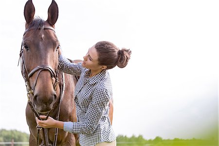 simsearch:6113-08220442,k - Woman petting horse Foto de stock - Sin royalties Premium, Código: 6113-08220440