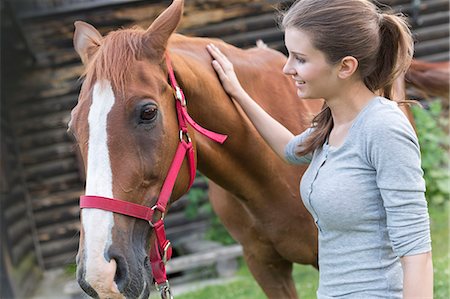 simsearch:6113-08220442,k - Woman petting horse Foto de stock - Sin royalties Premium, Código: 6113-08220414