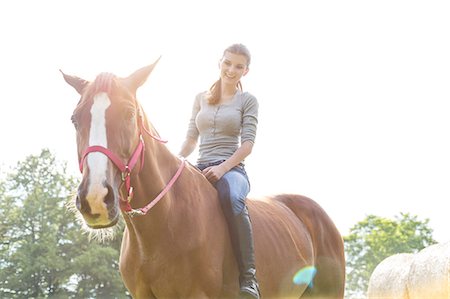 person riding horse - Smiling woman riding horse bareback Stock Photo - Premium Royalty-Free, Code: 6113-08220428