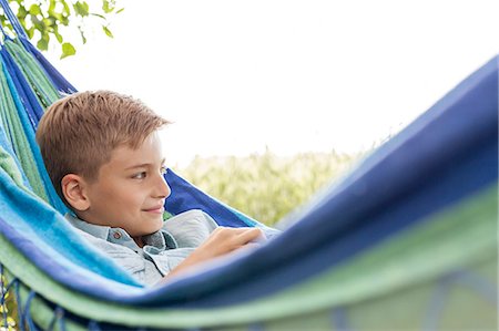 simsearch:6128-08747485,k - Boy relaxing in hammock Stockbilder - Premium RF Lizenzfrei, Bildnummer: 6113-08220520