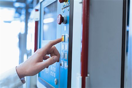 factory and closeup - Close up of worker at control panel in factory Stock Photo - Premium Royalty-Free, Code: 6113-08393669