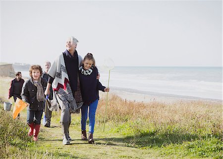 senior adult - Multi-generation family walking on grassy beach path Stock Photo - Premium Royalty-Free, Code: 6113-08393704