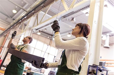 simsearch:6113-08393833,k - Workers hanging steel part in factory Stock Photo - Premium Royalty-Free, Code: 6113-08393841